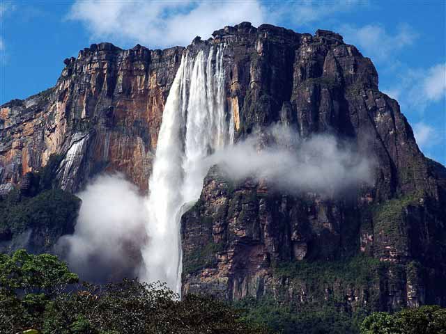 One of the greatest natural wonders of the world, magnificent Angel Falls, remains virtually masked to mankind in the rugged jungle and mountain of Venezuela. Today, Angel Falls is the greatest tourist draw in Venezuela.Nestled deep in the recesses of Canaima National Park in the Venezuelan state of Bolivar, the towering waterfall drops from a height of 979 meters off the top of Auyantepui.Known in Venezuela as 