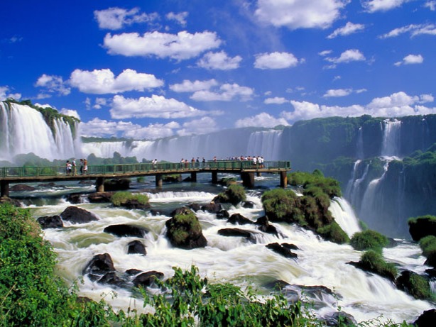 ou might have seen the photos. Even read about it. You might have visited other great waterfalls before. But you probably still have no idea what to expect when you come face to face with the almighty Iguazu Falls, on the border of the Argentina province of Misiones and the Brazilian state of Parana.To describe the Iguazu Falls without gushing superlatives is a futile exercise. With water cascades as far as the eye can see -- some massive and powerful, some small and dainty -- the Iguazu Falls are a shock to the system.
