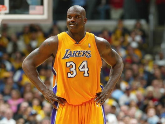 Career playoff stats: 24.3 PPG, 11.6 RPG, 2.1 BPGAccolades: 4 NBA titles, 3 Finals MVPs, 1 reg. season MVPShaquille O'Neal was the most dominant player of his generation—possibly of all time. It was borderline unfair how he brutalized defenders with brute strength.Shaq led the Los Angeles Lakers to three consecutive NBA Championships in the early 2000s, winning three Finals MVPs in the process. The 2000 regular season MVP winner was also selected to 14 All-NBA Teams in his career.