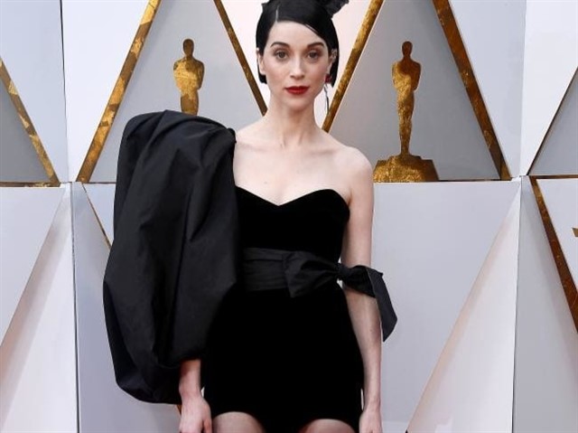 Indie singer St. Vincent, who will appear on stage performing Oscar-nominated Call Me By Your Name song Mystery of Love with Sufjan Stevens, brought art-rock quirk to the red carpet.At least you could smuggle in a few drinks under that sleeve