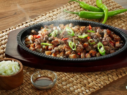 Sisig is a Filipino dish made from parts of pig head and liver, usually seasoned with calamansi and chili peppers.Sisig was first mentioned in a Kapampangan dictionary in the 17th Century meaning 