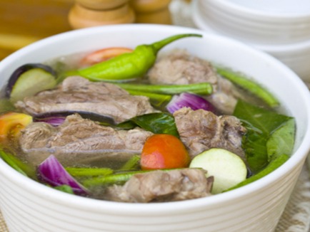 Sinigang is a Filipino soup or stew characterized by its sour and savoury taste most often associated with tamarind(Filipino: sampalok). It is one of the more popular viands in Filipino cuisine, and is related to the Malaysian dish singgang.While present nationwide, sinigang is seen to be culturally Tagalog in origin, thus the versions found in the Visayas and Mindanao may differ in taste (mainly ginger is an additional ingredient). Fish sauce is a common condiment for the stew.Source: https://en.wikipedia.org/wiki/Sinigang