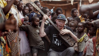 Lazarus is a short documentary following Lazarus Chigwandali, a street musician with Albinism from Malawi as he teams up with a London-based music pro...